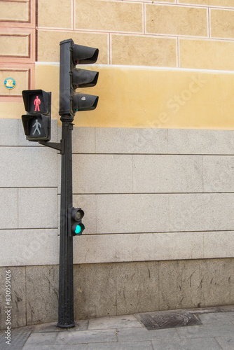 traffic light in front of a wall on a street in Madrid. Spain photo