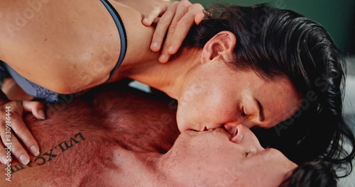 Couple, kiss and sex with intimacy for love, passion or sexual desire for intercourse together at home. Man, woman or sexy lovers touching with passion for affection or sensual seduction in bedroom