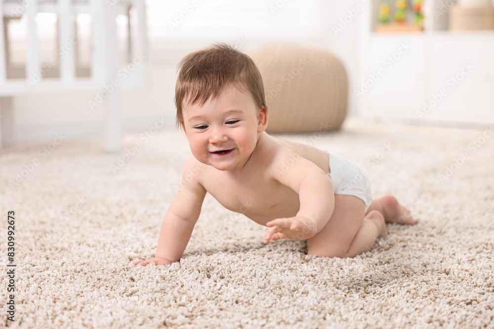 Cute baby boy crawling on carpet at home Cute baby boy crawling on carpet at home