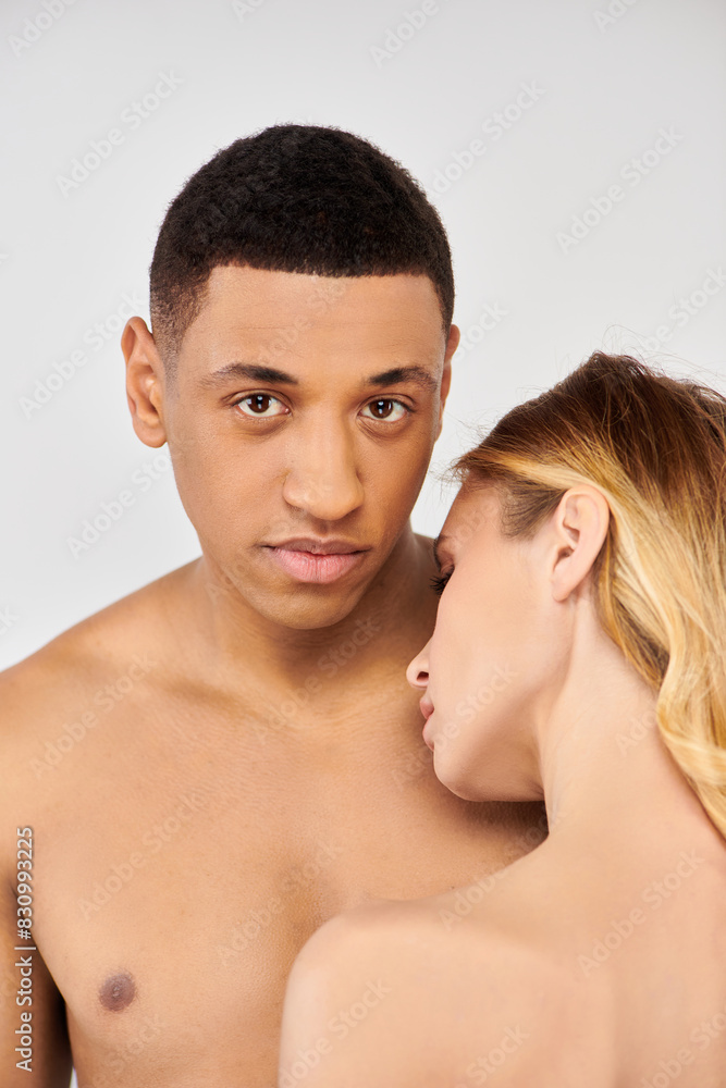 Trendy couple posing intimately together. Trendy couple posing intimately together.