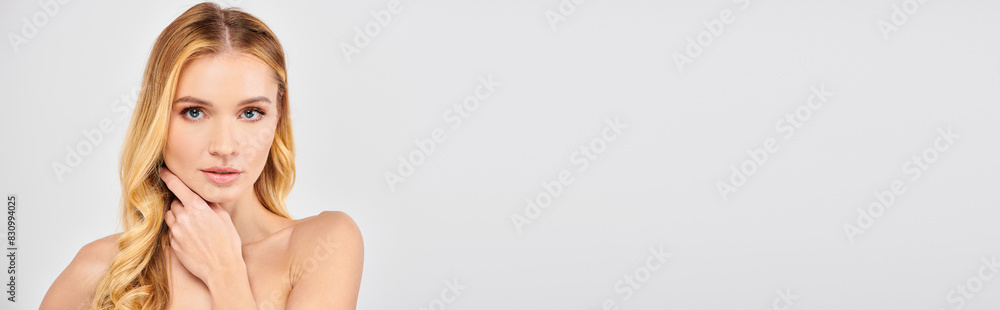 Woman posing gracefully with hands on face. Woman posing gracefully with hands on face.
