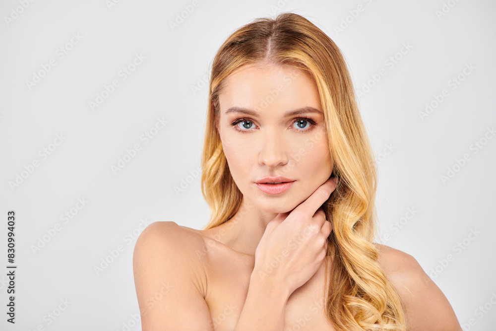 © LIGHTFIELD STUDIOS - Young woman strikes a thoughtful pose with hand resting on chin. © LIGHTFIELD STUDIOS - Young woman strikes a thoughtful pose with hand resting on chin.