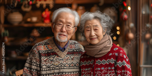 An older Asian couple standing side by side © alenagurenchuk