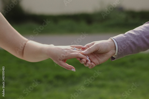 bride and groom holding hands photo