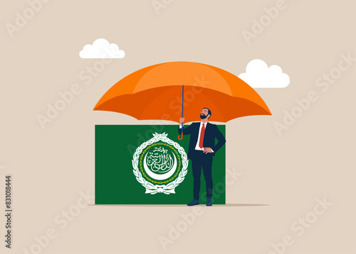 Investor with flag Arab League covered by big umbrella. Insurance and finance saving protection in economy crisis in League of Arab States, safety investment or all weather portfolio in Arab League.