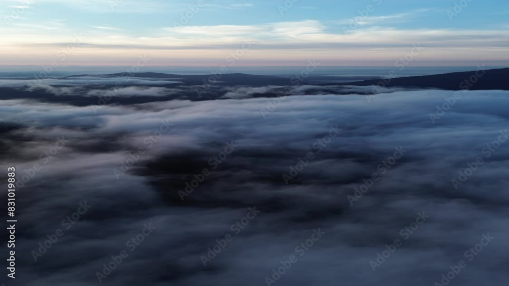 Vertical 4k bird's eye view flying over a mountain in the morning fog covering the morning and the weather is clear. mountains of Thailand Vertical 4k bird's eye view flying over a mountain in the morning fog covering the morning and the weather is clear. mountains of Thailand
