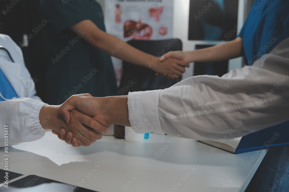 Doctor handshake and partnership in healthcare, medicine or trust for collaboration, unity or support.Team of medical experts shaking hands in teamwork for or success in hospital Doctor handshake and partnership in healthcare, medicine or trust for collaboration, unity or support.Team of medical experts shaking hands in teamwork for or success in hospital
