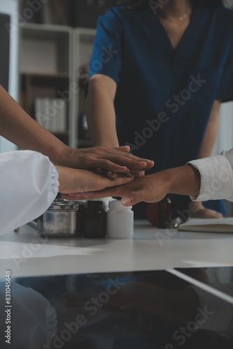 Doctor handshake and partnership in healthcare, medicine or trust for collaboration, unity or support.Team of medical experts shaking hands in teamwork for or success in hospital
