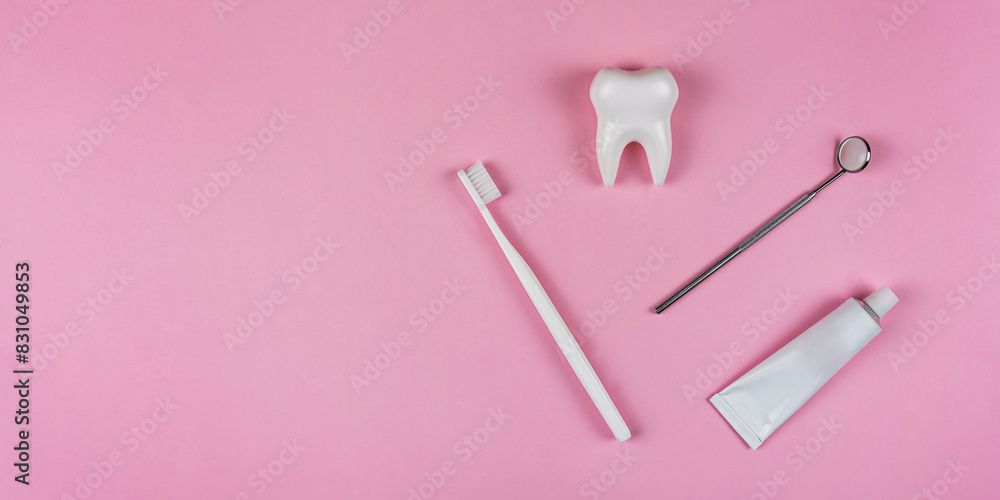 Healthy white tooth, toothpaste and toothbrush on a pink background. The concept of dentistry, health, health care, oral care. Oral hygiene, professional teeth cleaning for a dental clinic, copyspace Healthy white tooth, toothpaste and toothbrush on a pink background. The concept of dentistry, health, health care, oral care. Oral hygiene, professional teeth cleaning for a dental clinic, copyspace