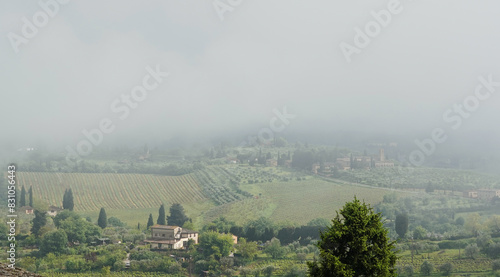 The view of the hills in Tuscany on a very foggy day, San Gimignano 
