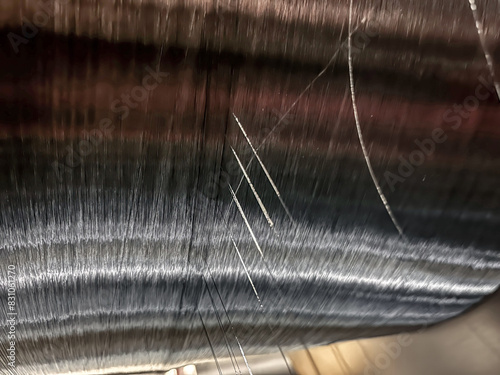 Monofilament winding on the warp coil in the textile industry damage requiring repair photo