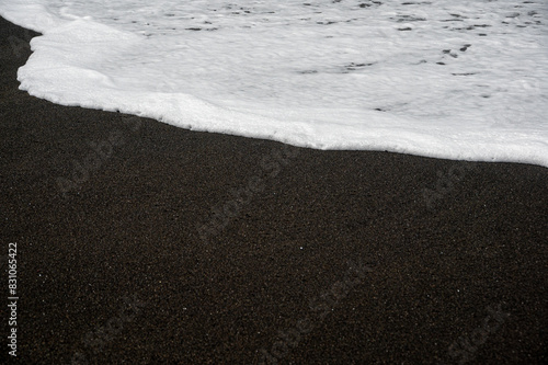 Waves crashing over rocks at Ajuy, Fuerteventura, Spain photo