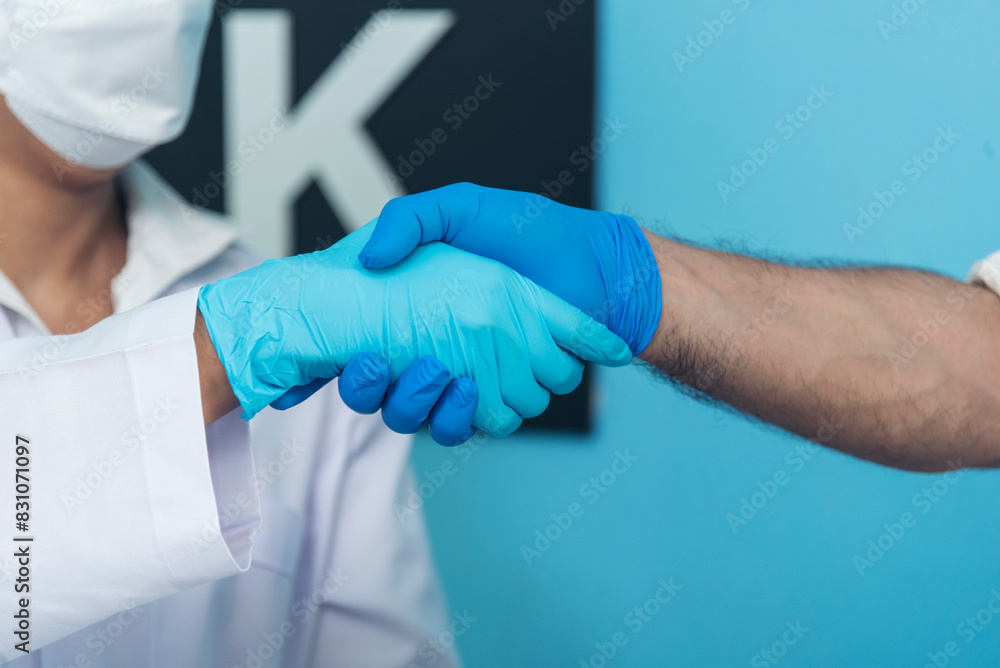 Two caucasian scientist men woman fist bump team partner shake hands together. Teamwork two scientist science chemistry research in laboratory. Close up hands pharmaceutical science team partnership Two caucasian scientist men woman fist bump team partner shake hands together. Teamwork two scientist science chemistry research in laboratory. Close up hands pharmaceutical science team partnership