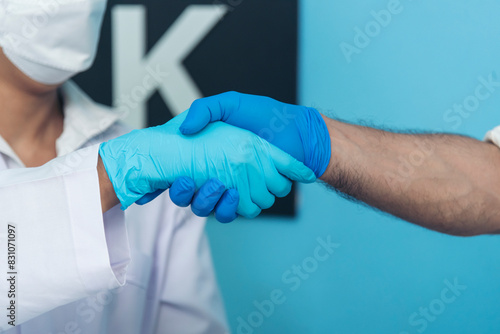 Two caucasian scientist men woman fist bump team partner shake hands together. Teamwork two scientist science chemistry research in laboratory. Close up hands pharmaceutical science team partnership