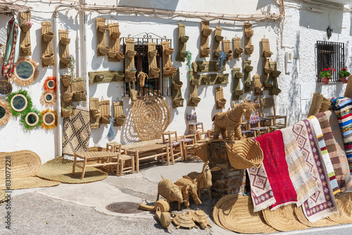 Small traditional business in a white Andalusian village selling handmade esparto grass products. photo