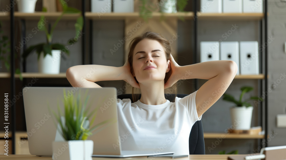 Relaxed Woman Taking a Break at Her Desk Relaxed Woman Taking a Break at Her Desk