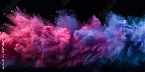 Colorful spray of powder on black background