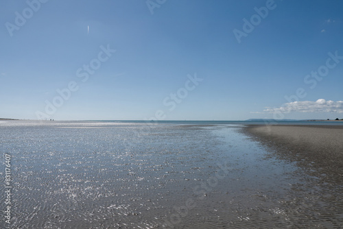 beautiful sandy beach at West Wittering West Sussex England with blue sky in the background
