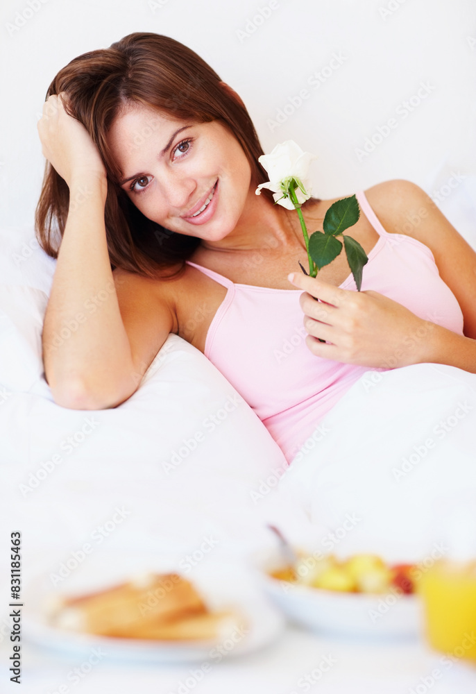 Breakfast in bed, flower and portrait with woman in hotel for food, hospitality or room service. Bedroom, relax and smile with happy guest smelling fresh scent of rose in accommodation for eating Breakfast in bed, flower and portrait with woman in hotel for food, hospitality or room service. Bedroom, relax and smile with happy guest smelling fresh scent of rose in accommodation for eating