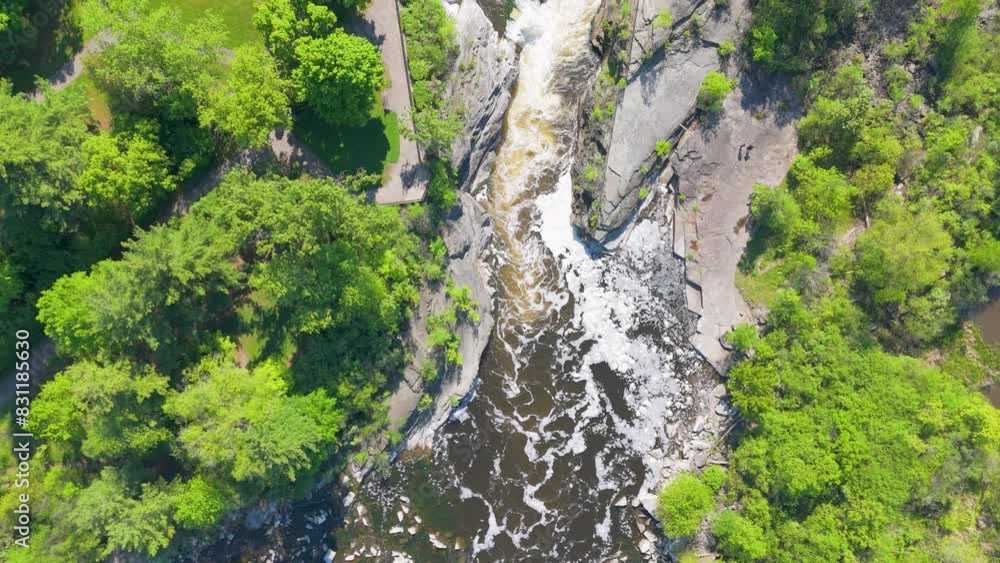 Top down view of a scenic river surrounded by lush greenery and rocky cliffs, offering a breathtaking natural landscape. Top down view of a scenic river surrounded by lush greenery and rocky cliffs, offering a breathtaking natural landscape.