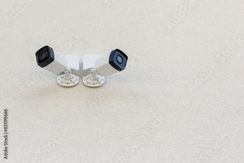 Two external city CCTV security cameras on the wall of the house. Safe and comfortable urban environment. Crime control and prevention. Street security, security. Improving the quality of city life.