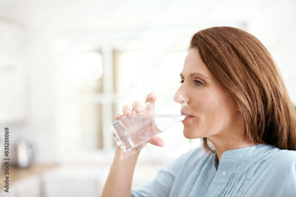 Home, kitchen and woman with drinking water in glass for minerals, hydration and healthy diet. Female person, thirsty and thinking with aqua in house for liquid detox, wellness and h2o nutrition Home, kitchen and woman with drinking water in glass for minerals, hydration and healthy diet. Female person, thirsty and thinking with aqua in house for liquid detox, wellness and h2o nutrition