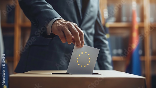 Voting in the European Union Elections. A hand puts paper in a ballot box.