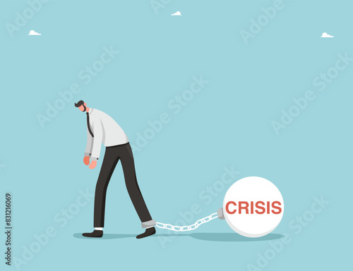 Financial difficulties, decrease in value of business or company shares, stock market crash, economic crisis, business failure, loss of cash, lose investments, a man is shackled in crisis.