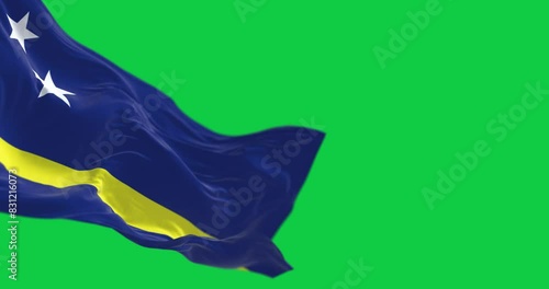 Close-up of Curacao flag waving in the wind isolated on green background photo