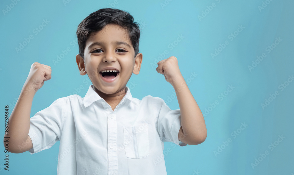 little boy raised hand and giving cheerful expression little boy raised hand and giving cheerful expression