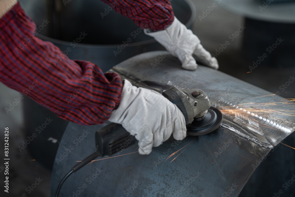 person working with power tool in factory person working with power tool in factory