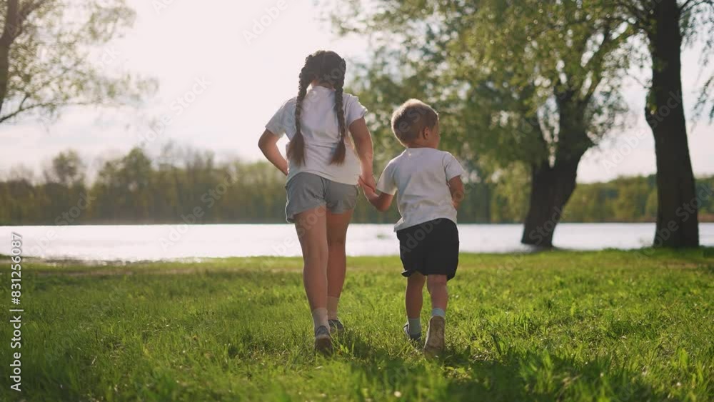 kid child run family the forest. happy family kid dream concept. The children are running in the park, enjoying nature beauty. brother sister running holding hands lifestyle kid child run family the forest. happy family kid dream concept. The children are running in the park, enjoying nature beauty. brother sister running holding hands lifestyle