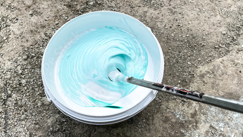 Preparing paint for use, mixing colors photo