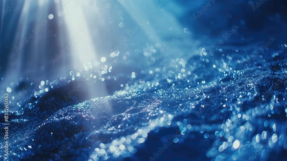Blue glitter particles gently cascading in soft light rays, forming an enchanting and continuous loop Blue glitter particles gently cascading in soft light rays, forming an enchanting and continuous loop