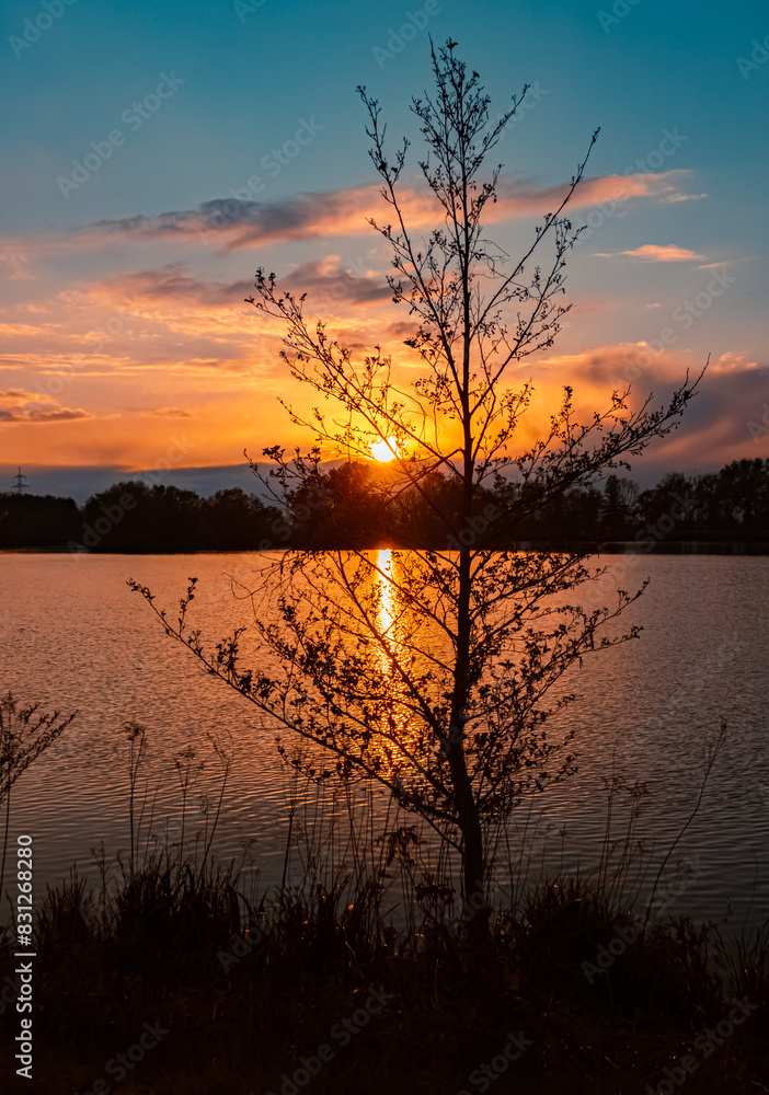 Sunset with reflections near Plattling, Isar, Bavaria, Germany Sunset with reflections near Plattling, Isar, Bavaria, Germany