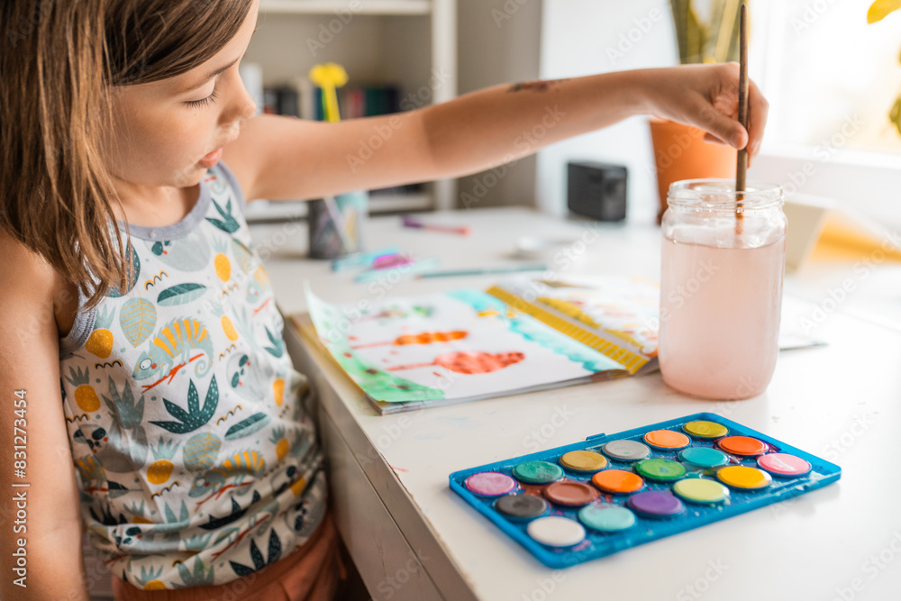 Child draws with watercolor paints. Chilren creativity,art an craft concept. Child draws with watercolor paints. Chilren creativity,art an craft concept.