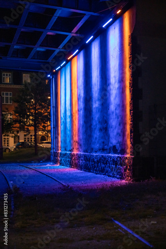 Light show on wall in a tunnel.
