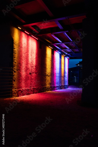 Light show on a wall in a tunnel.