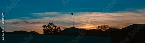 Sunset with mountain silhouettes near Kiefersfelden, Bavaria, Germany photo