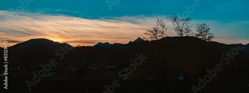 Sunset with mountain silhouettes near Kiefersfelden, Bavaria, Germany photo