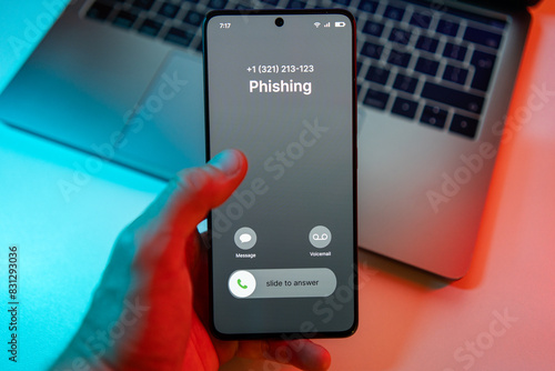 Phishing call concept on mobile phone. Person get phish call alert. Phone call from unknown number late at night. Scam, fraud or phishing with smartphone concept. Prank caller, scammer or stranger photo