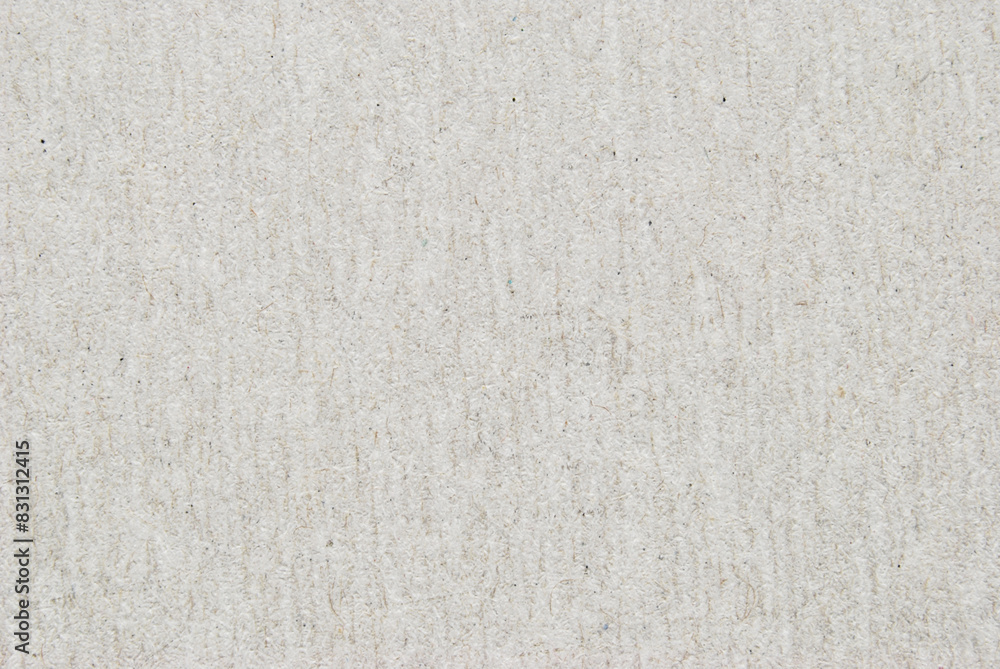 A sheet of gray recycled cardboard texture as background A sheet of gray recycled cardboard texture as background