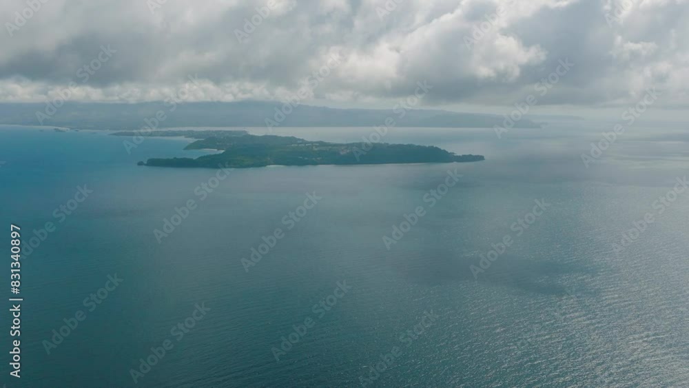 Aerial view of Island surrounded by blue sea water. Blue sky and clouds. San Jose, Romblon. Philippines. Aerial view of Island surrounded by blue sea water. Blue sky and clouds. San Jose, Romblon. Philippines.