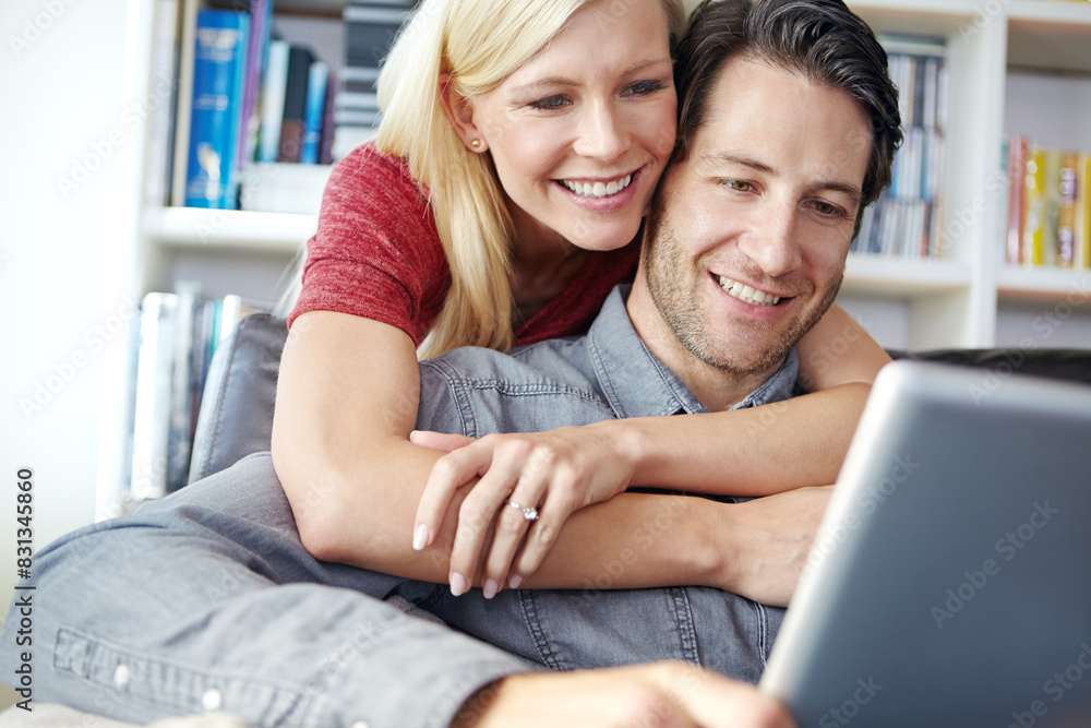 Happy, couple and hugging in living room with tablet, relax online and people smile for internet browse together. Social media, web and scrolling for relationship bonding, networking and apartment Happy, couple and hugging in living room with tablet, relax online and people smile for internet browse together. Social media, web and scrolling for relationship bonding, networking and apartment