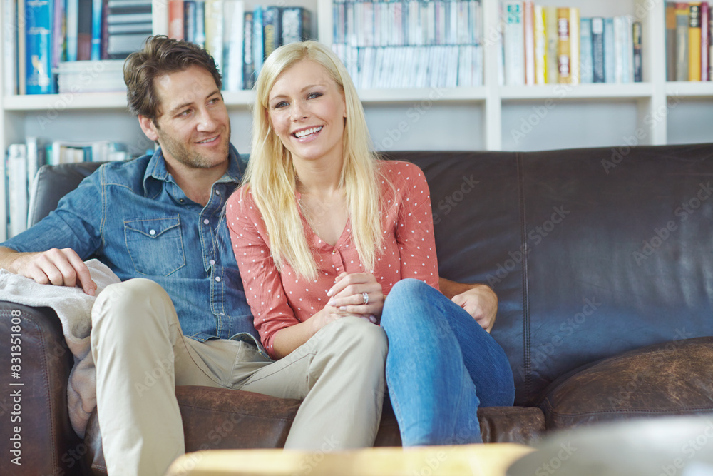 Obraz premium Smile, hug and happy couple on couch with romance, care and bonding in home lounge. Embrace, man and woman on sofa relaxing, love and enjoying conversation, relationship and weekend in living room