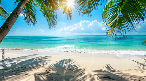 Tropical beach landscape featuring palm tree and sunlight falling on water with great copy space  Summer theme.