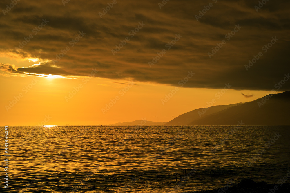 Fototapeta premium The sky is orange and the sun is setting