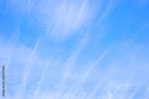 sky with feathery clouds on a blue background