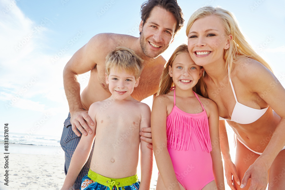 Portrait, smile and family with children at beach in swimsuit for holiday trip, summer vacation or weekend getaway. Love, happy people and young kids for travel, adventure or bonding together at sea Portrait, smile and family with children at beach in swimsuit for holiday trip, summer vacation or weekend getaway. Love, happy people and young kids for travel, adventure or bonding together at sea