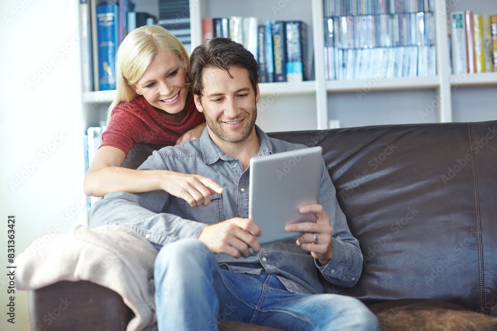 Happy, couple and house sofa with tablet or relaxing online, people smile and internet browse together on social media. Web, scrolling and relationship bonding, networking and communication apartment Happy, couple and house sofa with tablet or relaxing online, people smile and internet browse together on social media. Web, scrolling and relationship bonding, networking and communication apartment